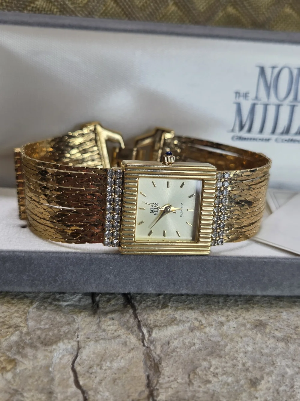 Nolan Miller Gold Chain Bracelet Watch  Rhinestone Accents Blue Sapphire Crown